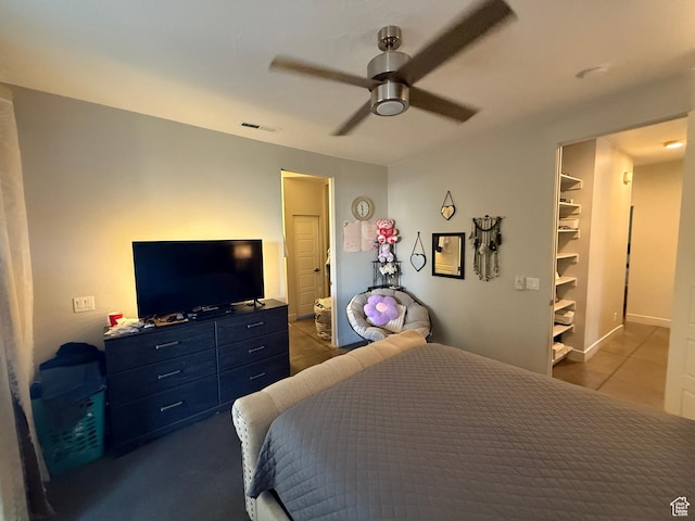 410 N 2720 E, St George, UT 84790 - tiled bedroom with a ceiling fan and a walk in closet
