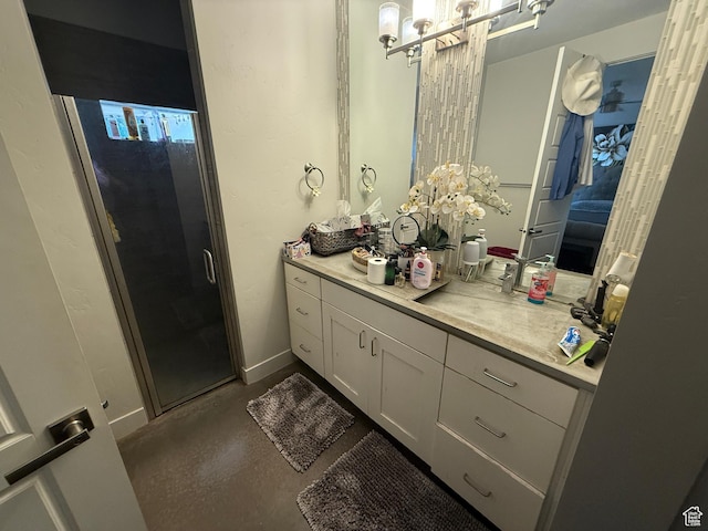 410 N 2720 E, St George, UT 84790 - bathroom featuring vanity, a shower stall, and baseboards