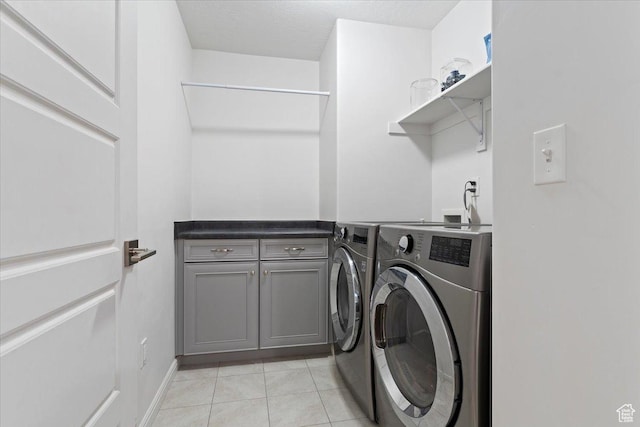 1252 W Cinch Way S, Bluffdale, UT 84065 - laundry area featuring washer and clothes dryer, cabinet space, and light tile patterned floors
