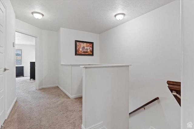 1252 W Cinch Way S, Bluffdale, UT 84065 - hall with an upstairs landing, light carpet, a textured ceiling, and baseboards