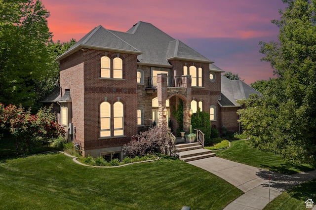 8149 S 2425 E, South Weber, UT 84405 - french country home with brick siding, a balcony, a front yard, and a shingled roof