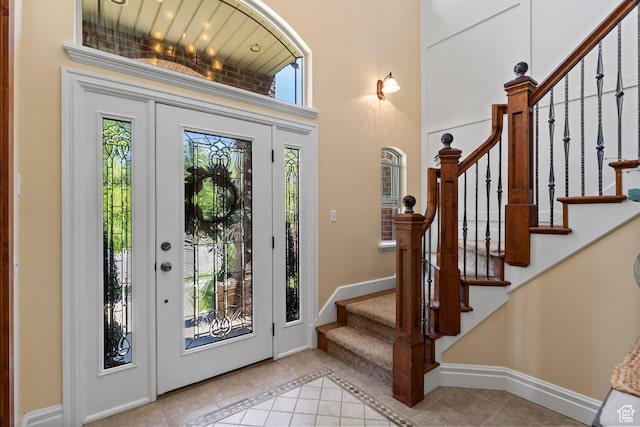 8149 S 2425 E, South Weber, UT 84405 - foyer entrance featuring tile patterned floors, stairs, and a high ceiling