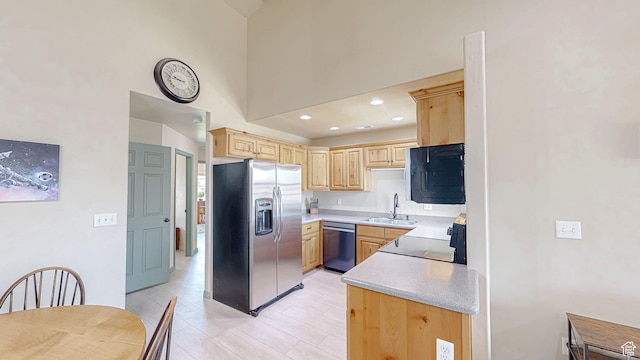 2515 W 450 S Unit 7, Springville, UT 84663 - kitchen with stainless steel appliances, light brown cabinets, light countertops, a sink, and a high ceiling