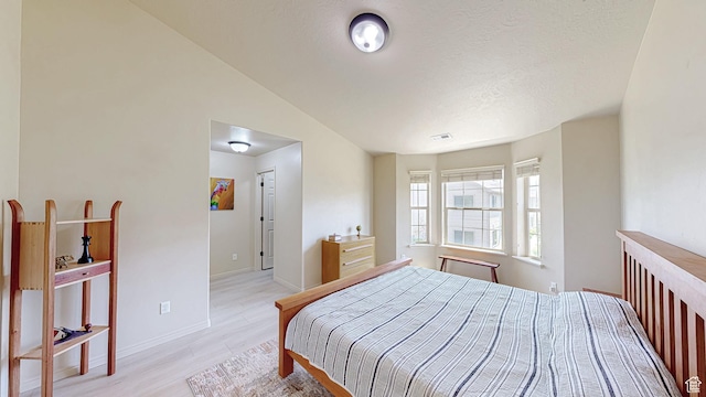 2515 W 450 S Unit 7, Springville, UT 84663 - bedroom with light wood finished floors, baseboards, and a textured ceiling