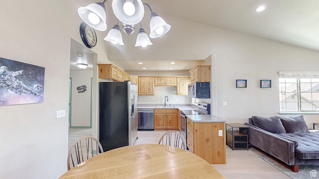 2515 W 450 S Unit 7, Springville, UT 84663 - kitchen with stainless steel appliances, a sink, light brown cabinetry, vaulted ceiling, and light countertops