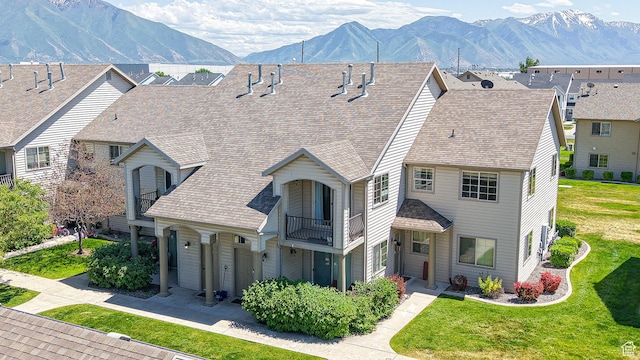 2515 W 450 S Unit 7, Springville, UT 84663 - view of front of property with a balcony, a front yard, a mountain view, and a shingled roof