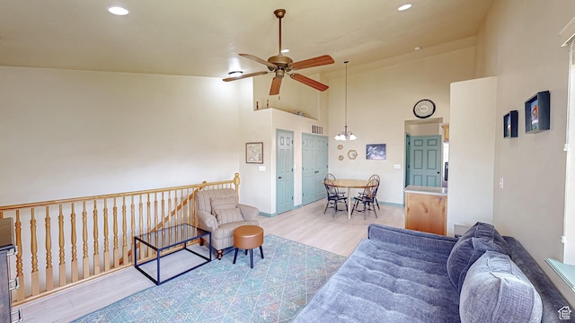 2515 W 450 S Unit 7, Springville, UT 84663 - living area featuring a ceiling fan, wood finished floors, high vaulted ceiling, recessed lighting, and baseboards