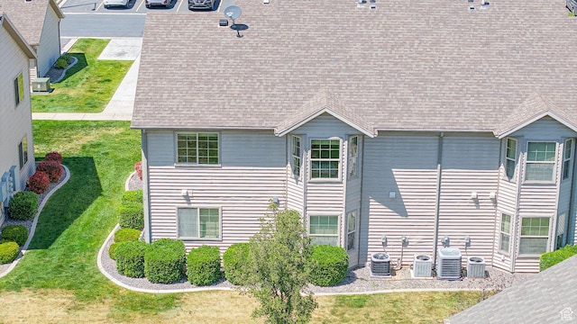 2515 W 450 S Unit 7, Springville, UT 84663 - rear view of house featuring a shingled roof, a yard, and central air condition unit