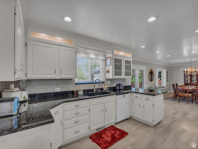 6386 S Lombardy Dr, Cottonwood Heights, UT 84121 - kitchen with white dishwasher, a sink, ornamental molding, a peninsula, and white cabinets