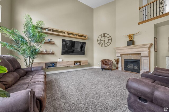 673 S Parkway Dr, North Salt Lake, UT 84054 - carpeted living room with baseboards, a tiled fireplace, and a high ceiling