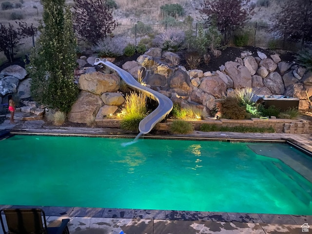 673 S Parkway Dr, North Salt Lake, UT 84054 - view of swimming pool with a water slide