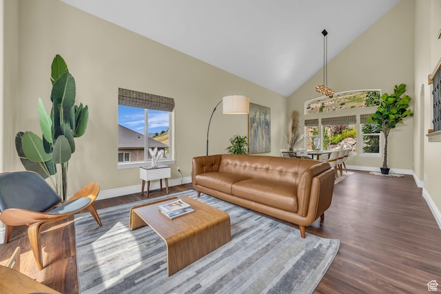 673 S Parkway Dr, North Salt Lake, UT 84054 - living room featuring baseboards, wood finished floors, and high vaulted ceiling