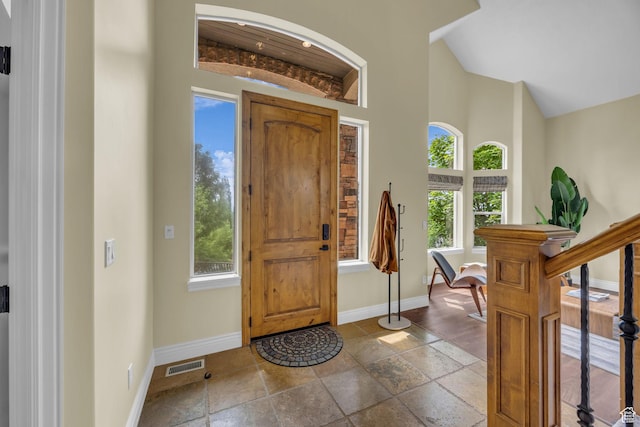 673 S Parkway Dr, North Salt Lake, UT 84054 - foyer entrance featuring baseboards, plenty of natural light, and a high ceiling