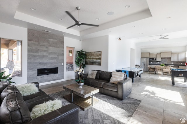 266 N 2020 W # 74, Hurricane, UT 84737 - living room with ceiling fan, a raised ceiling, recessed lighting, and a tile fireplace