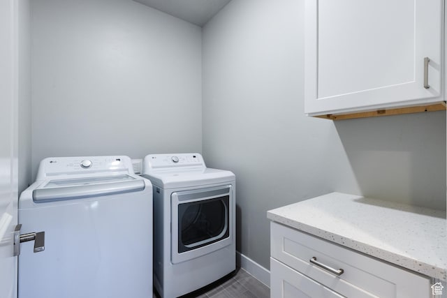 266 N 2020 W # 74, Hurricane, UT 84737 - laundry area featuring washing machine and dryer, cabinet space, and baseboards