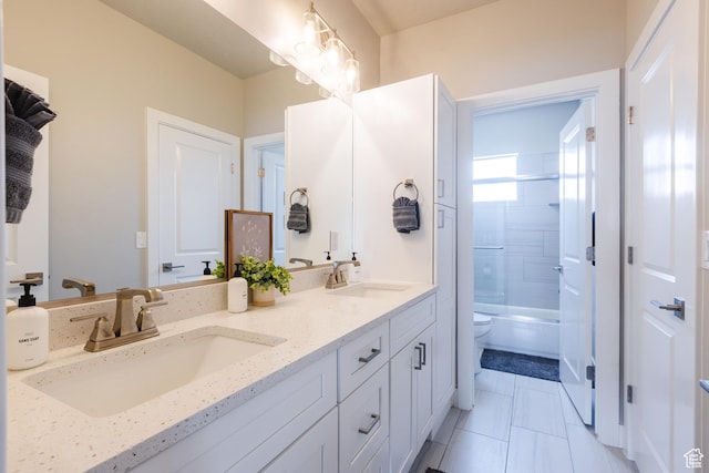 266 N 2020 W # 74, Hurricane, UT 84737 - bathroom with double vanity, toilet, shower / tub combination, and tile patterned floors