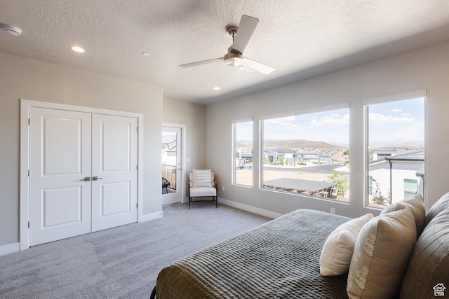 266 N 2020 W # 74, Hurricane, UT 84737 - bedroom with light colored carpet, baseboards, recessed lighting, a closet, and a ceiling fan