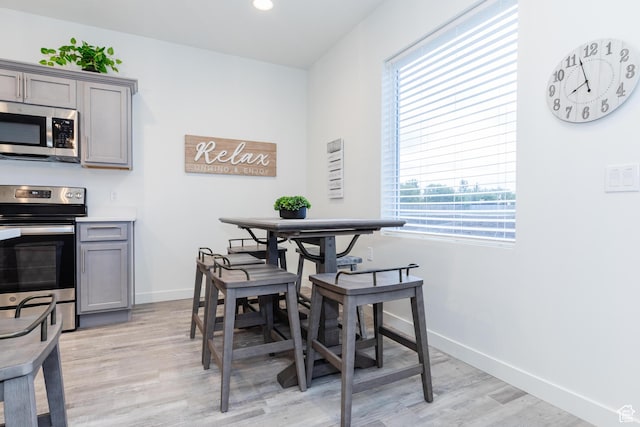 356 W Oregon Trail Dr Unit 100, Garden City, UT 84028 - dining area with light wood finished floors, baseboards, and recessed lighting