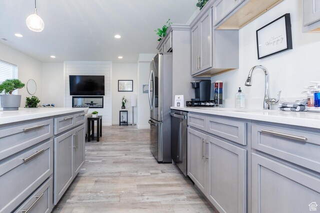 356 W Oregon Trail Dr Unit 100, Garden City, UT 84028 - kitchen featuring gray cabinets, appliances with stainless steel finishes, light wood-type flooring, light countertops, and recessed lighting