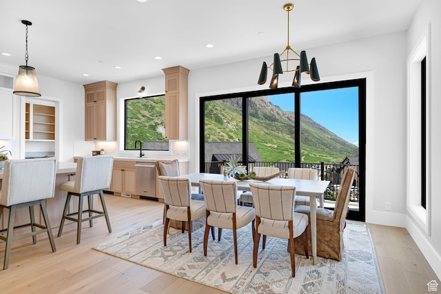 3851 W Box Elder Cir, Alpine, UT 84004 - dining room with light wood-style flooring, recessed lighting, a chandelier, a mountain view, and baseboards
