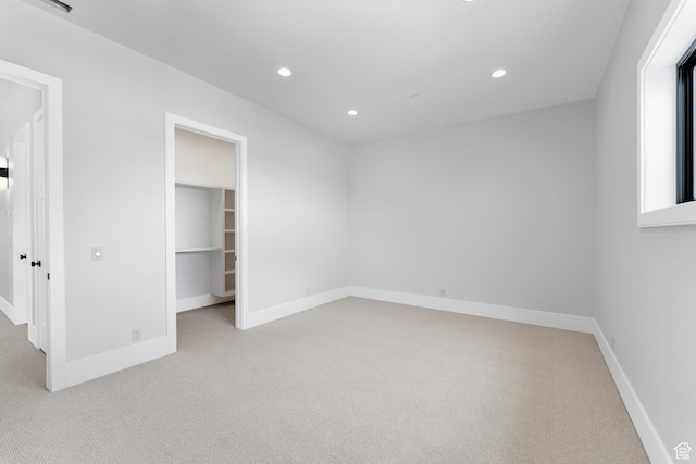 3851 W Box Elder Cir, Alpine, UT 84004 - unfurnished bedroom with light carpet, recessed lighting, a walk in closet, and baseboards