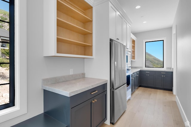 3851 W Box Elder Cir, Alpine, UT 84004 - kitchen with appliances with stainless steel finishes, open shelves, light countertops, healthy amount of natural light, and recessed lighting