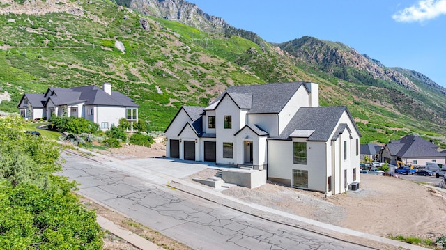 3851 W Box Elder Cir, Alpine, UT 84004 - view of front of home featuring stucco siding, asphalt driveway, and a mountain view