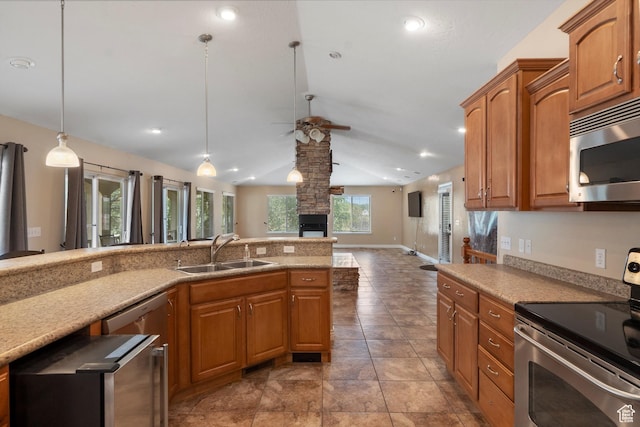 1754 E Cedar Trails Way, Eagle Mountain, UT 84005 - kitchen with stainless steel appliances, a sink, lofted ceiling, a ceiling fan, and brown cabinets