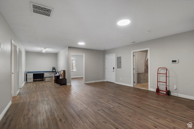 1754 E Cedar Trails Way, Eagle Mountain, UT 84005 - unfurnished living room with electric panel, dark wood-type flooring, and baseboards