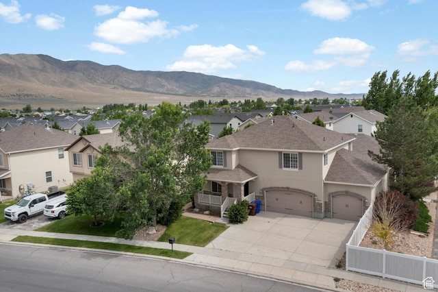 1754 E Cedar Trails Way, Eagle Mountain, UT 84005 - view of front of house featuring stucco siding, a residential view, driveway, and roof with shingles
