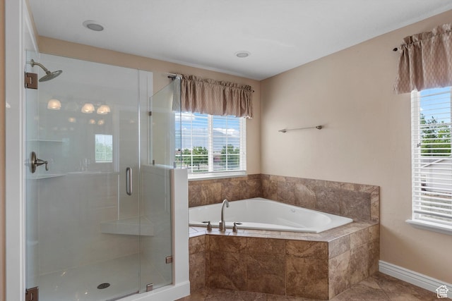 1754 E Cedar Trails Way, Eagle Mountain, UT 84005 - full bathroom featuring healthy amount of natural light, a garden tub, a stall shower, and tile patterned flooring