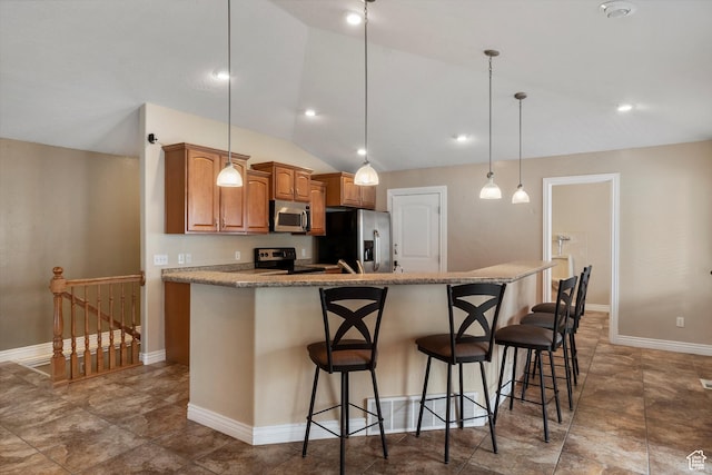 1754 E Cedar Trails Way, Eagle Mountain, UT 84005 - kitchen featuring appliances with stainless steel finishes, lofted ceiling, a kitchen bar, brown cabinets, and an island with sink