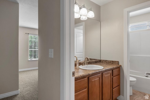 1754 E Cedar Trails Way, Eagle Mountain, UT 84005 - full bathroom with vanity, toilet, baseboards, and washtub / shower combination