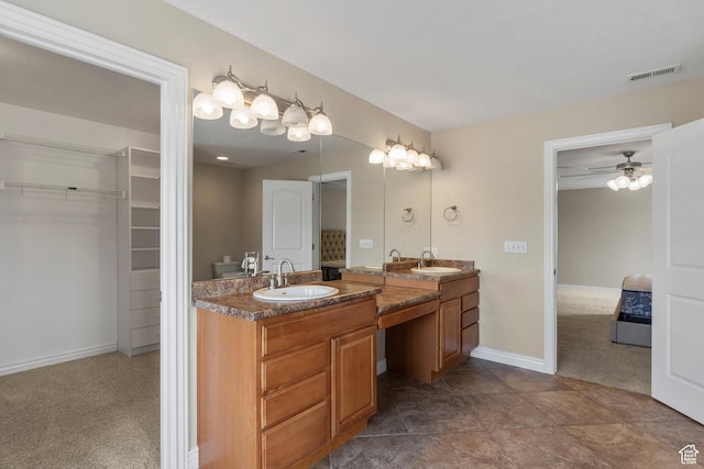 1754 E Cedar Trails Way, Eagle Mountain, UT 84005 - full bath with double vanity, a walk in closet, a ceiling fan, and baseboards