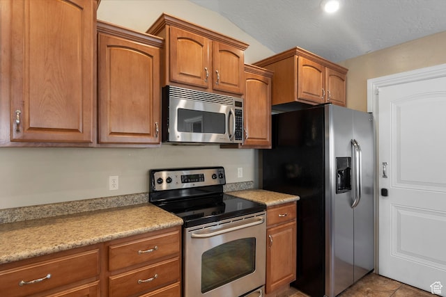 1754 E Cedar Trails Way, Eagle Mountain, UT 84005 - kitchen featuring appliances with stainless steel finishes, brown cabinetry, and light countertops