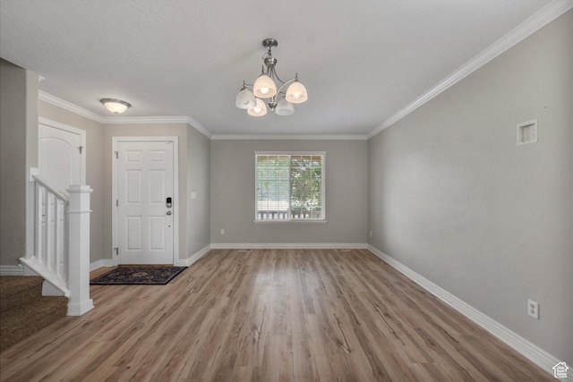 1754 E Cedar Trails Way, Eagle Mountain, UT 84005 - foyer entrance with stairs, wood finished floors, baseboards, and crown molding