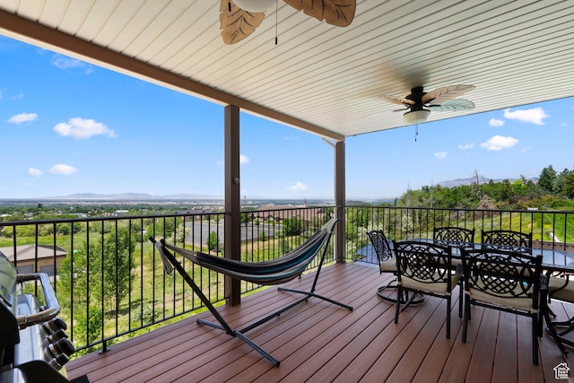 4715 S 1500 E, Ogden, UT 84403 - wooden terrace featuring ceiling fan, outdoor dining space, and a mountain view
