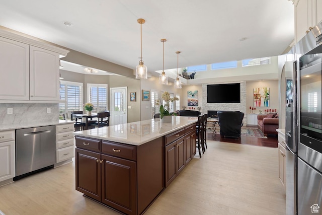 4715 S 1500 E, Ogden, UT 84403 - kitchen with dishwasher, light wood-type flooring, dark brown cabinets, white cabinetry, and decorative backsplash