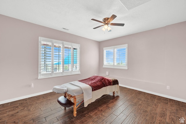 4715 S 1500 E, Ogden, UT 84403 - bedroom featuring wood finished floors, baseboards, a ceiling fan, and a textured ceiling