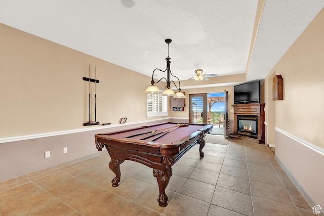 4715 S 1500 E, Ogden, UT 84403 - game room with a ceiling fan, a multi sided fireplace, pool table, and tile patterned flooring
