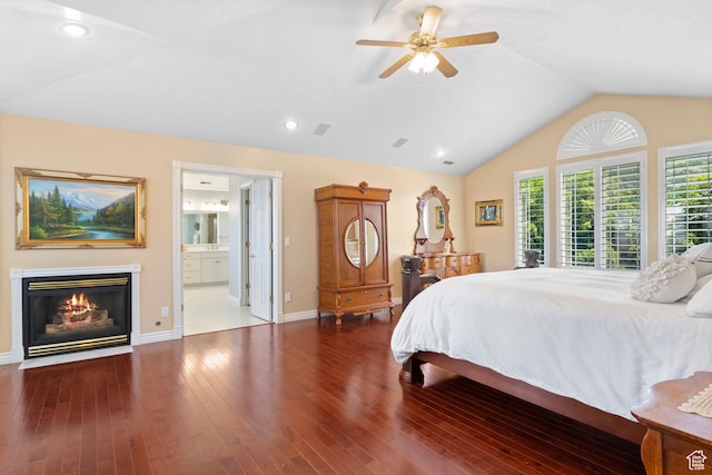 4715 S 1500 E, Ogden, UT 84403 - bedroom with a glass covered fireplace, baseboards, vaulted ceiling, wood finished floors, and ensuite bath