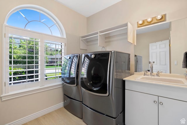 4715 S 1500 E, Ogden, UT 84403 - laundry room featuring separate washer and dryer, light wood-type flooring, and baseboards
