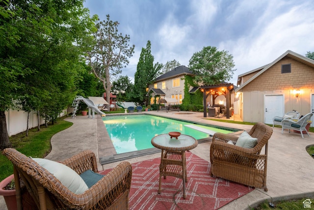13279 S Berry Ln, Draper, UT 84020 - view of swimming pool with a water slide, a diving board, and a patio area