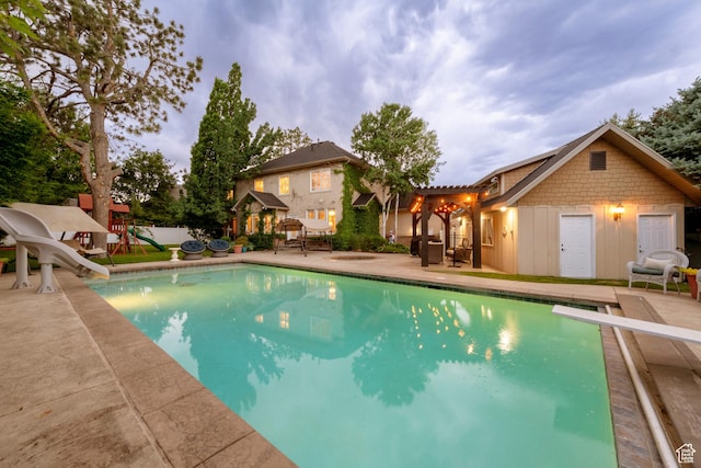 13279 S Berry Ln, Draper, UT 84020 - swimming pool with a water slide, a patio area, a diving board, and a playground