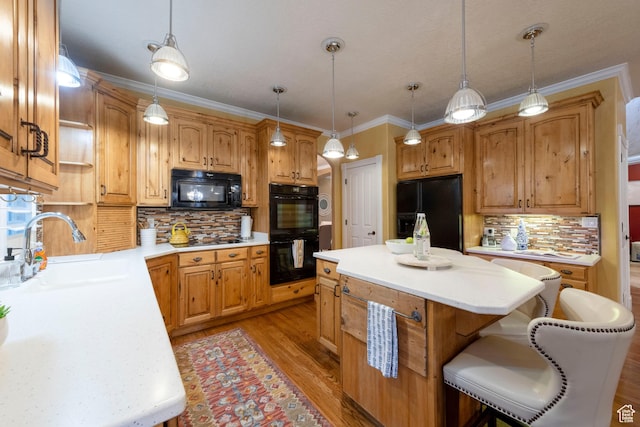 13279 S Berry Ln, Draper, UT 84020 - kitchen featuring black appliances, a sink, a center island, backsplash, and crown molding