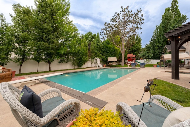 13279 S Berry Ln, Draper, UT 84020 - view of swimming pool with a water slide, a playground, a fenced backyard, and a patio