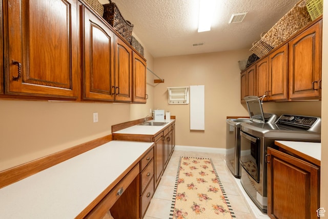13279 S Berry Ln, Draper, UT 84020 - laundry room with washer and dryer, cabinet space, a textured ceiling, light tile patterned floors, and baseboards