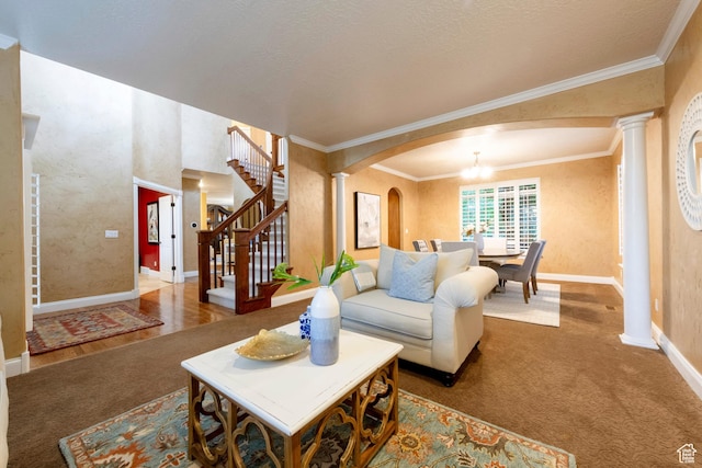 13279 S Berry Ln, Draper, UT 84020 - living room with ornate columns, arched walkways, carpet floors, ornamental molding, and baseboards
