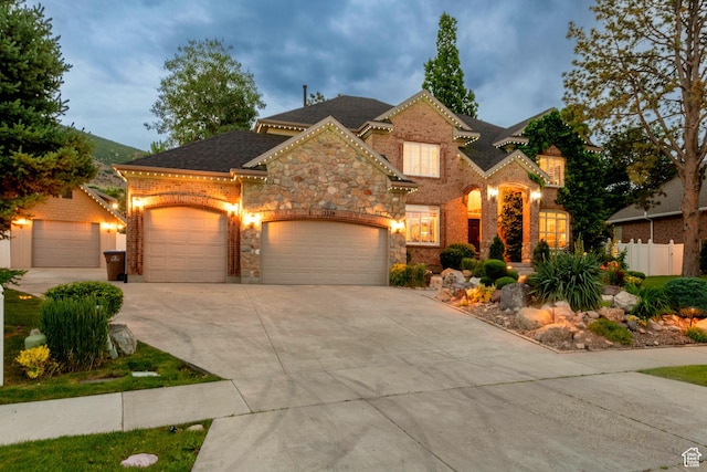 13279 S Berry Ln, Draper, UT 84020 - view of front of property featuring concrete driveway, a garage, stone siding, and brick siding