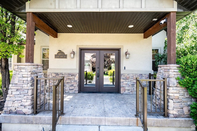 4488 S Haven Creek Rd W Unit 25D, West Haven, UT 84401 - property entrance featuring french doors, stone siding, stucco siding, and a gate